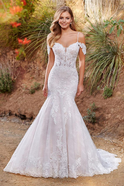 outdoor photo of woman wearing white sophia tolli designer wedding dress