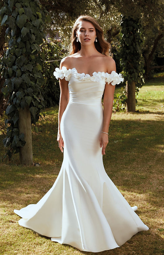 woman wearing white eddy k designer wedding dress outdoors
