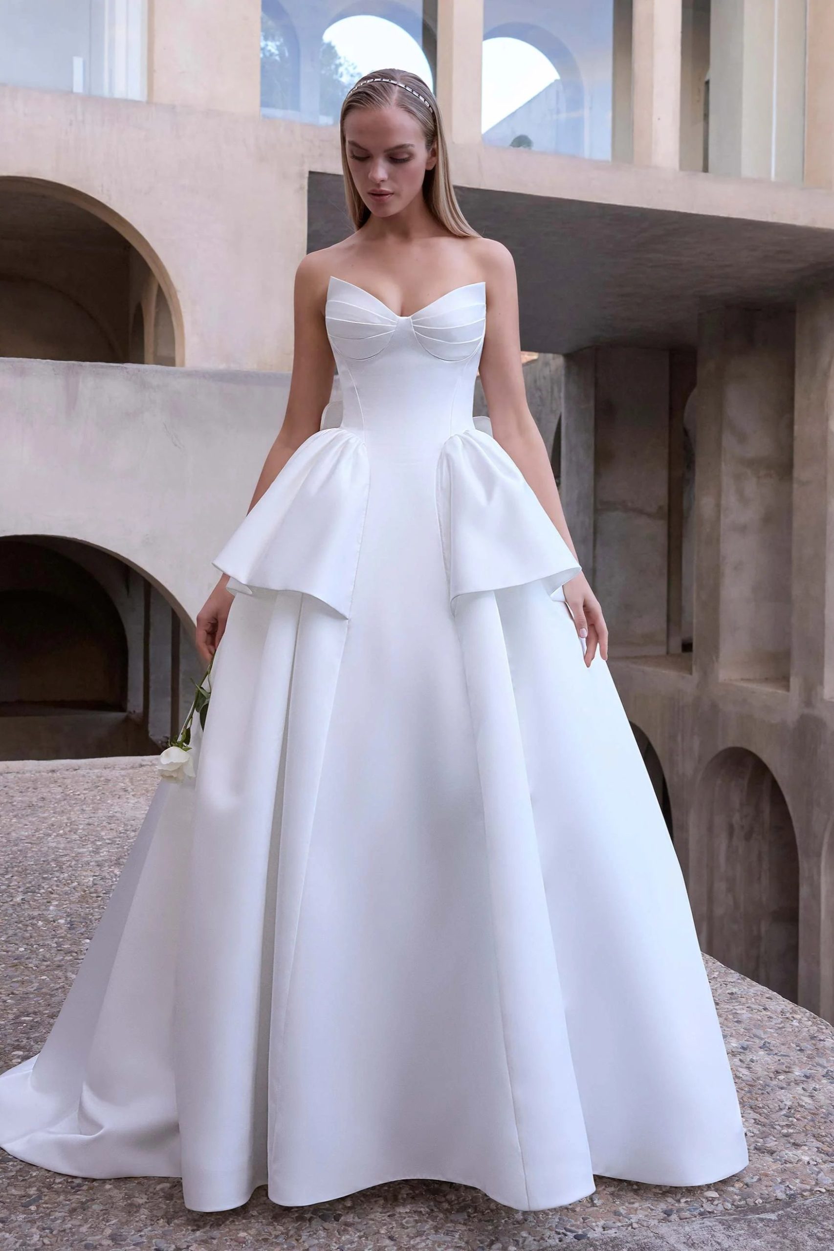 woman wearing morilee designer wedding dress outdoors